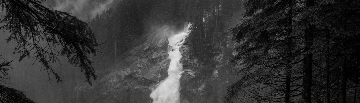 Waterfall with evergreens